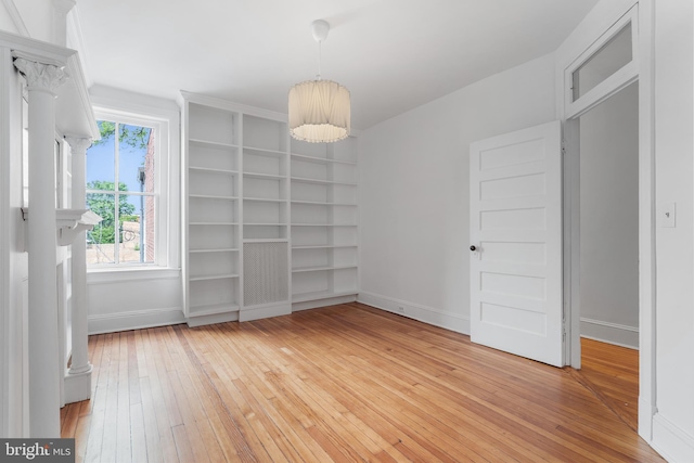 108 3rd St NE, Washington, DC 20002 - empty room with light wood-style flooring, built in features, and a chandelier