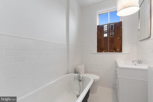 108 3rd St NE, Washington, DC 20002 - full bath featuring a freestanding bath, tile walls, vanity, and a wainscoted wall