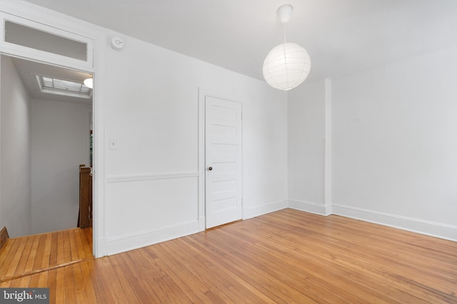 108 3rd St NE, Washington, DC 20002 - spare room with light wood-style floors and a smoke detector