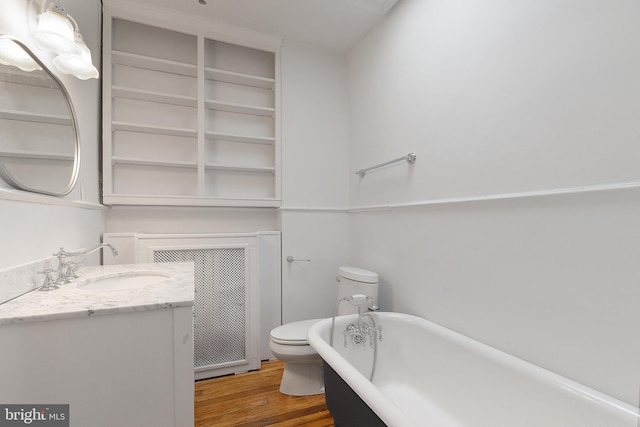 108 3rd St NE, Washington, DC 20002 - bathroom with a freestanding tub, vanity, and wood finished floors