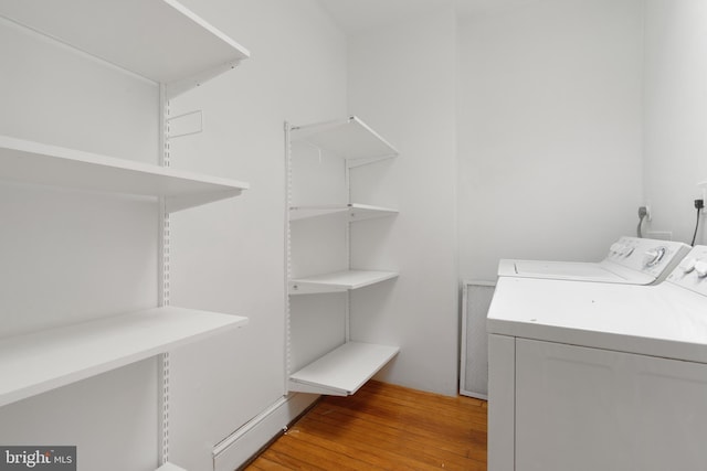 108 3rd St NE, Washington, DC 20002 - laundry room featuring washer and clothes dryer and light wood finished floors