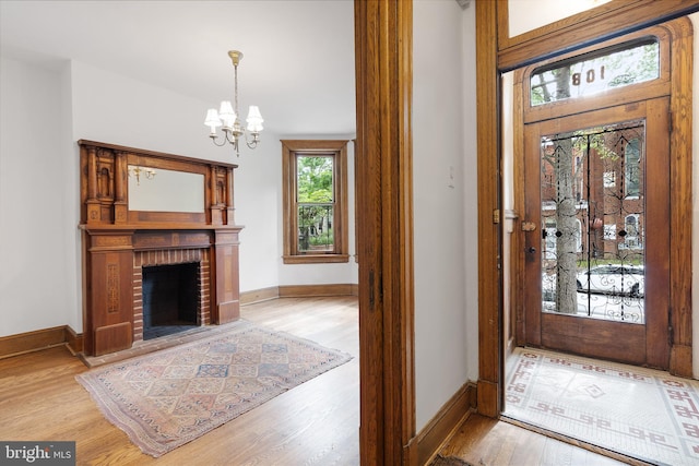 108 3rd St NE, Washington, DC 20002 - entrance foyer featuring a chandelier, wood finished floors, and a fireplace
