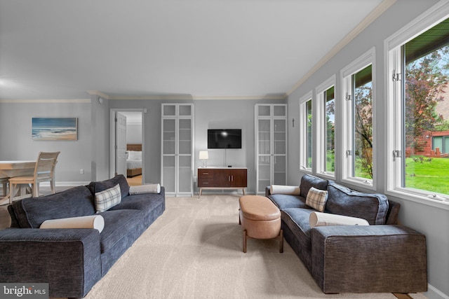carpeted living room featuring ornamental molding and baseboards