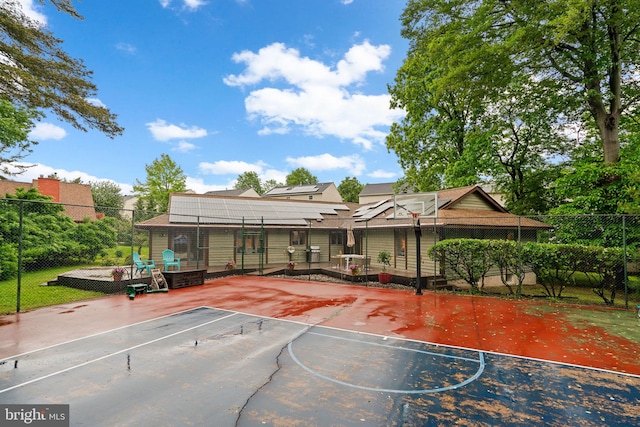 view of sport court with community basketball court and fence
