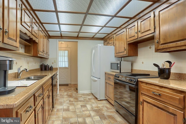438 N 4th St, Halifax, PA 17032 - kitchen featuring stainless steel microwave, black range with electric stovetop, baseboards, and backsplash