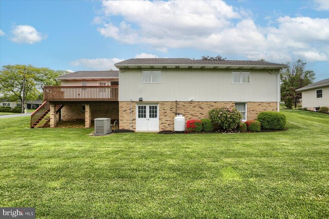438 N 4th St, Halifax, PA 17032 - rear view of house with a wooden deck, central AC, stairway, brick siding, and a lawn