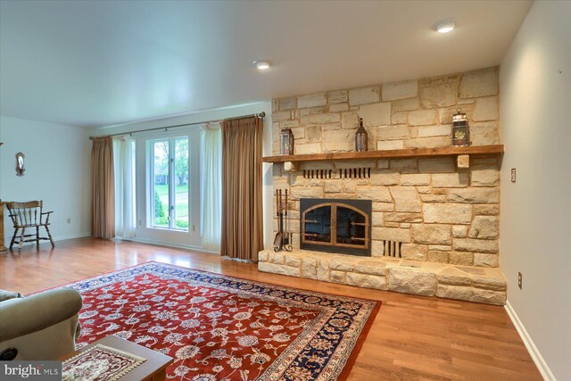 438 N 4th St, Halifax, PA 17032 - living room featuring wood finished floors, a fireplace, and baseboards