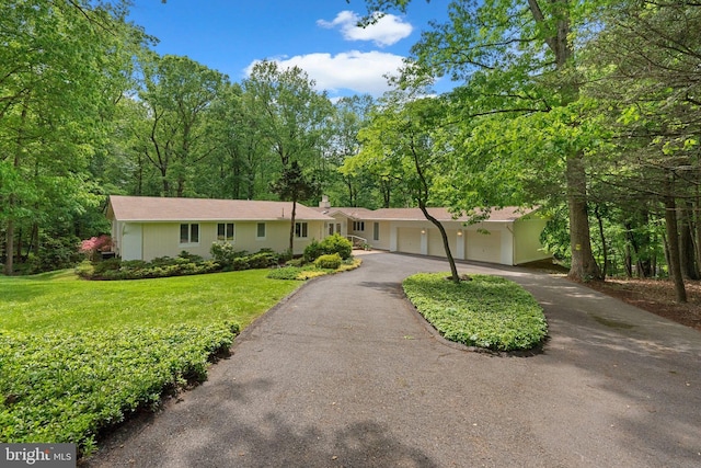 17810 Pond Rd, Ashton, MD 20861 - single story home featuring a garage, asphalt driveway, and a front yard