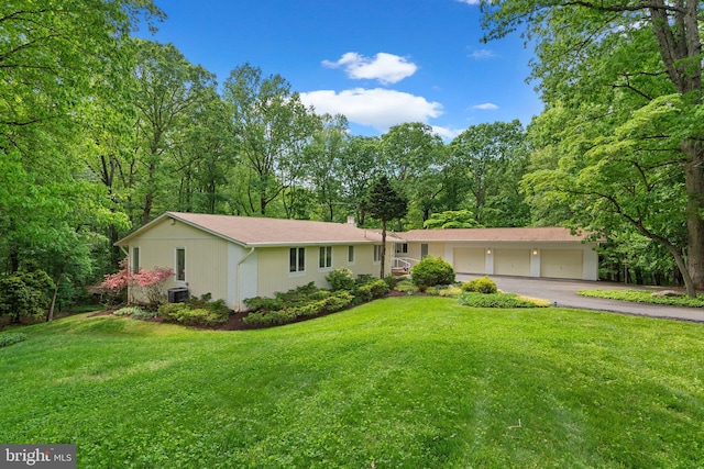17810 Pond Rd, Ashton, MD 20861 - ranch-style home with asphalt driveway, an attached garage, a front lawn, and central AC