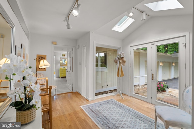 17810 Pond Rd, Ashton, MD 20861 - foyer featuring a skylight, track lighting, light wood-style floors, vaulted ceiling, and french doors