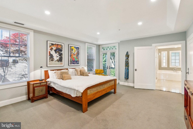 2915 38th St NW, Washington, DC 20016 - bedroom with baseboards, light carpet, multiple windows, recessed lighting, and ensuite bath