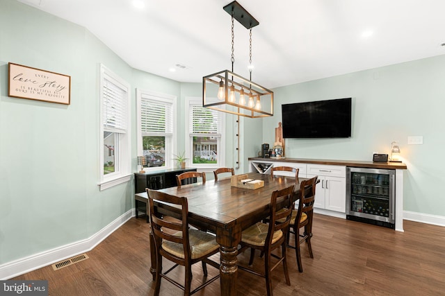 401 Woodland Ave, Glendora, NJ 08029 - dining space featuring wine cooler, a bar, dark wood-style flooring, baseboards, and recessed lighting
