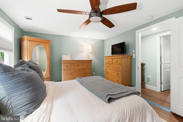 401 Woodland Ave, Glendora, NJ 08029 - bedroom with wood finished floors, ceiling fan, and baseboards