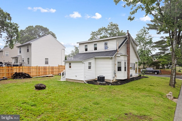 401 Woodland Ave, Glendora, NJ 08029 - rear view of property featuring a fire pit, a shingled roof, and central air condition unit