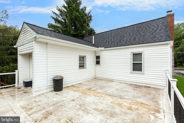6109 Oakland Mills Rd, Sykesville, MD 21784 - rear view of property with a chimney, roof with shingles, and a patio area