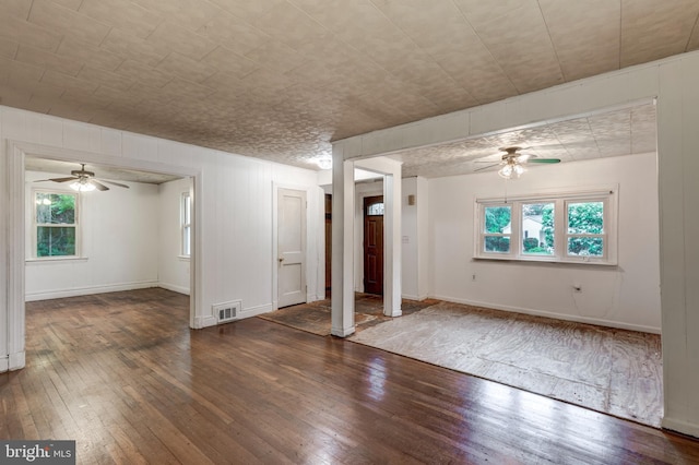 6109 Oakland Mills Rd, Sykesville, MD 21784 - unfurnished living room featuring ceiling fan, hardwood / wood-style flooring, ornate columns, and baseboards
