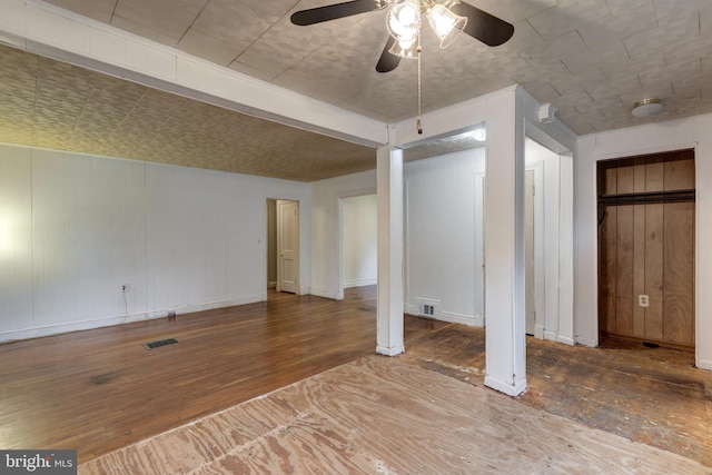 6109 Oakland Mills Rd, Sykesville, MD 21784 - unfurnished bedroom featuring hardwood / wood-style flooring, multiple closets, baseboards, and ceiling fan