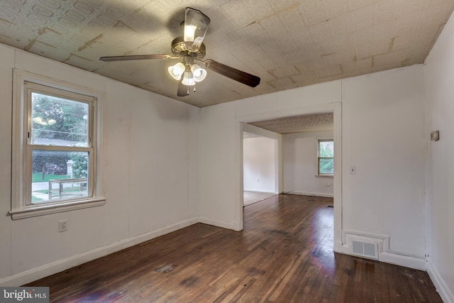 6109 Oakland Mills Rd, Sykesville, MD 21784 - unfurnished room with hardwood / wood-style floors, ceiling fan, baseboards, and an ornate ceiling