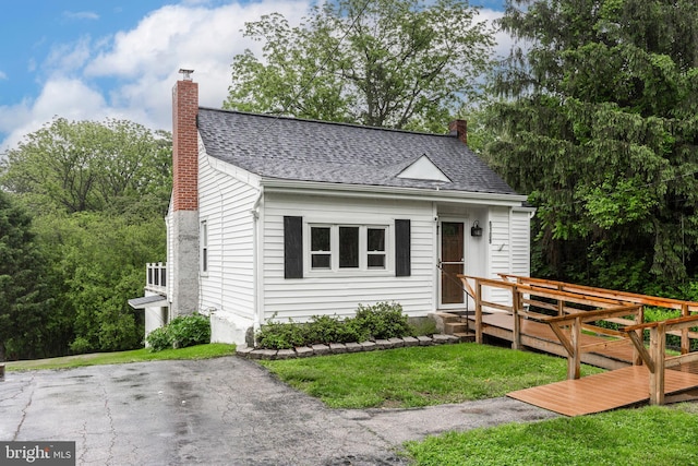 6109 Oakland Mills Rd, Sykesville, MD 21784 - bungalow with a chimney, a shingled roof, and a front lawn