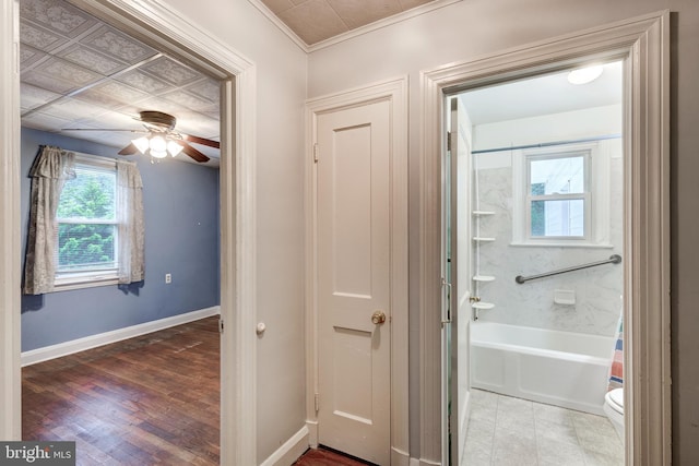 6109 Oakland Mills Rd, Sykesville, MD 21784 - bathroom with baseboards, a ceiling fan, toilet, ornamental molding, and bathtub / shower combination