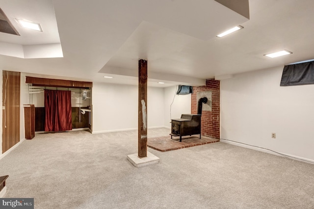 6109 Oakland Mills Rd, Sykesville, MD 21784 - finished below grade area with a wood stove, carpet flooring, and baseboards