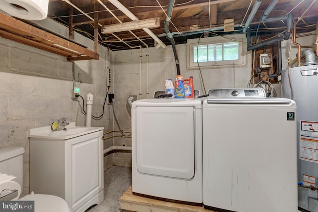 6109 Oakland Mills Rd, Sykesville, MD 21784 - laundry room featuring washer and dryer and gas water heater