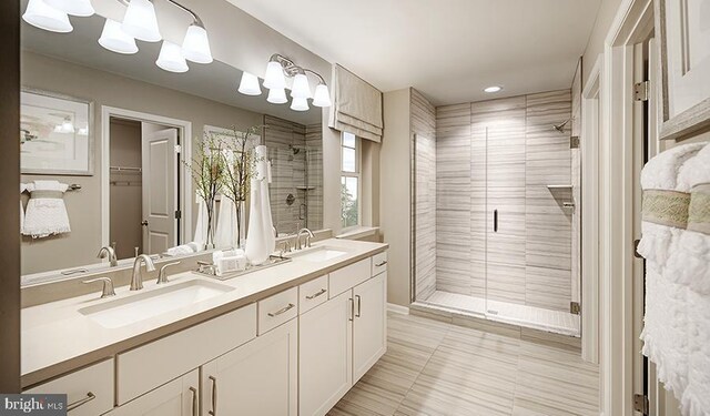full bathroom featuring a shower stall, tile patterned flooring, double vanity, a walk in closet, and recessed lighting
