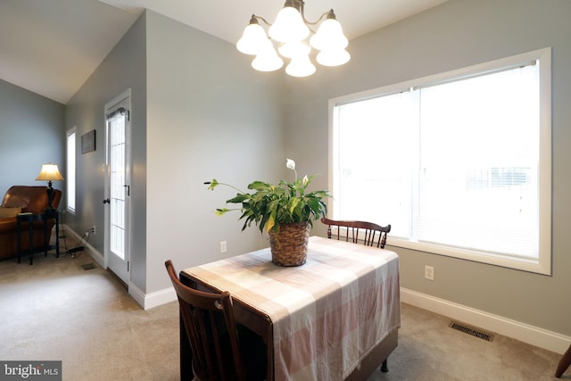 2408 Setter Run Ln, State College, PA 16801 - dining area with a chandelier, light colored carpet, healthy amount of natural light, and lofted ceiling