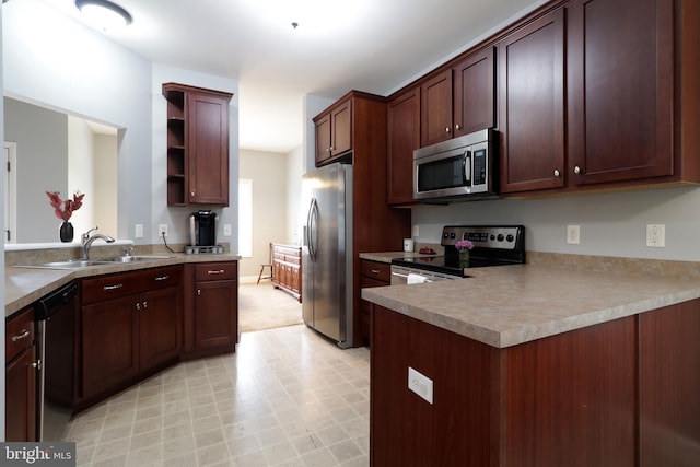 2408 Setter Run Ln, State College, PA 16801 - kitchen featuring appliances with stainless steel finishes, open shelves, a peninsula, and a sink