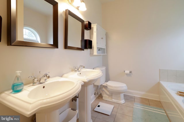 2408 Setter Run Ln, State College, PA 16801 - bathroom featuring baseboards, tile patterned flooring, a garden tub, and toilet