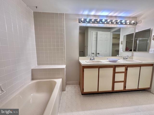 bathroom featuring tile patterned floors and double vanity