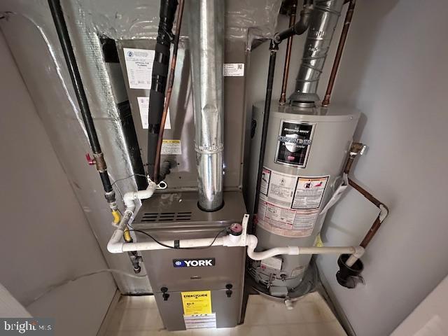 utility room with water heater