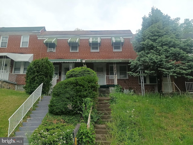 4709 Midwood Ave, Baltimore, MD 21212 - townhome / multi-family property with brick siding and stairway