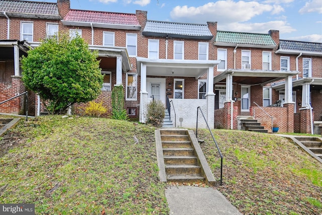 1081 Ellicott Dr, Baltimore, MD 21216 - multi unit property featuring a tile roof, mansard roof, and brick siding