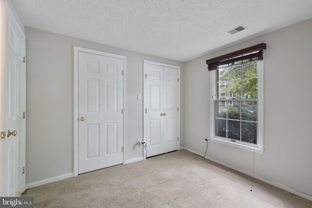 13113 Briarcliff Ter Unit 1-101, Germantown, MD 20874 - unfurnished bedroom with carpet floors, a textured ceiling, and baseboards