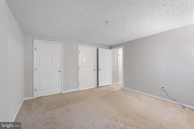 13113 Briarcliff Ter Unit 1-101, Germantown, MD 20874 - unfurnished bedroom with carpet floors, baseboards, and a textured ceiling