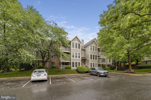 13113 Briarcliff Ter Unit 1-101, Germantown, MD 20874 - view of building exterior with uncovered parking