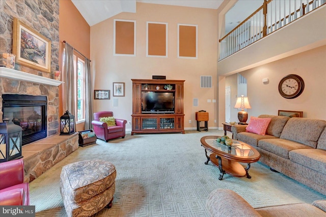 carpeted living area with high vaulted ceiling, a fireplace, and baseboards