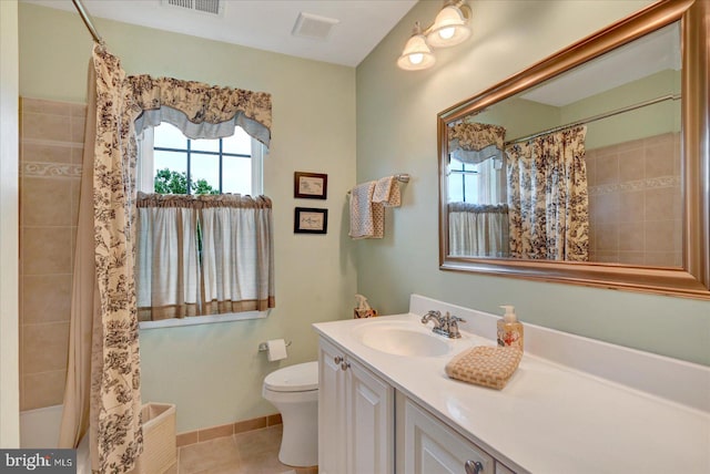 full bath with toilet, vanity, and tile patterned flooring