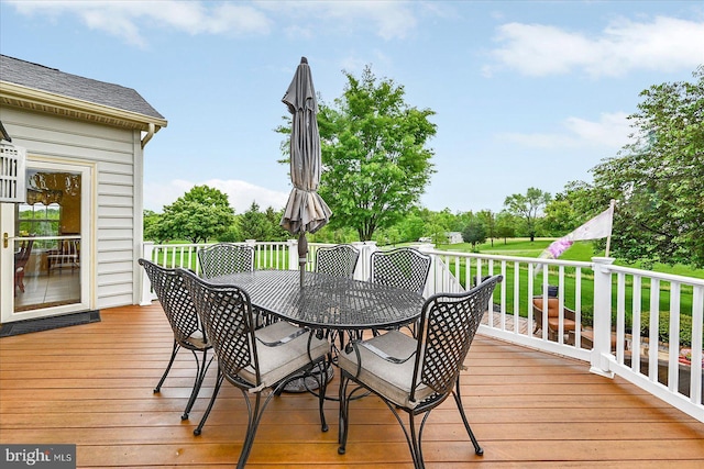 wooden terrace featuring outdoor dining space