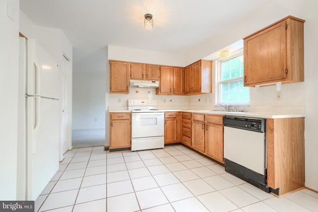 4001 Cedar Mills Rd, Randallstown, MD 21133 - kitchen featuring white appliances, under cabinet range hood, light countertops, and a sink