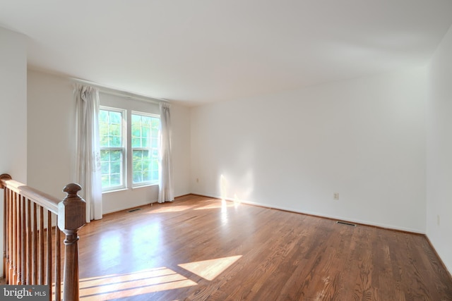 4001 Cedar Mills Rd, Randallstown, MD 21133 - spare room featuring wood finished floors and baseboards