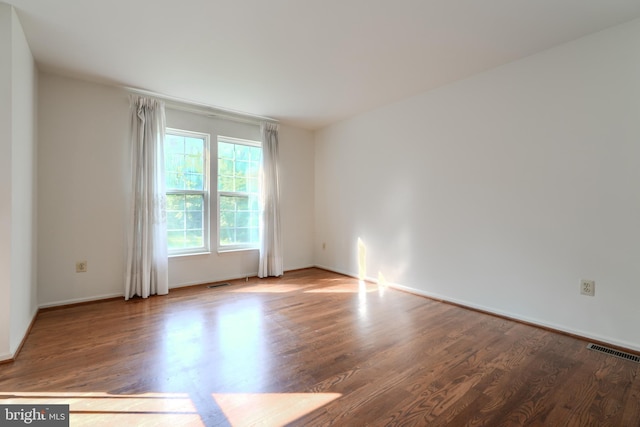 4001 Cedar Mills Rd, Randallstown, MD 21133 - empty room with wood finished floors and baseboards