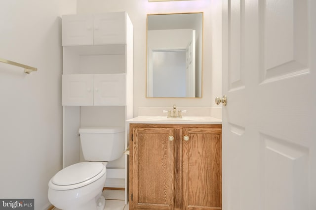 4001 Cedar Mills Rd, Randallstown, MD 21133 - half bath featuring vanity, toilet, and tile patterned floors