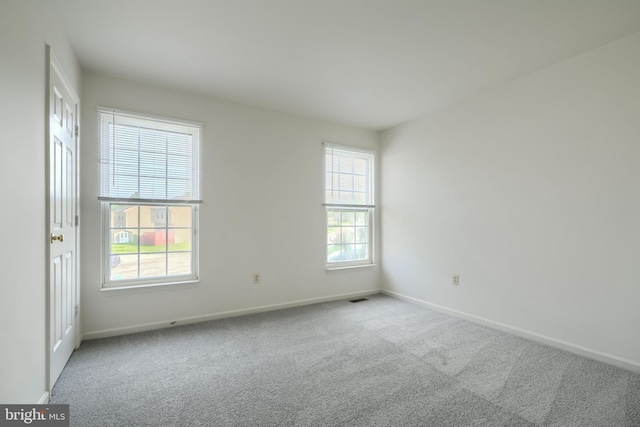 4001 Cedar Mills Rd, Randallstown, MD 21133 - carpeted empty room with baseboards