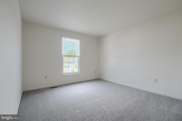 4001 Cedar Mills Rd, Randallstown, MD 21133 - carpeted empty room with baseboards