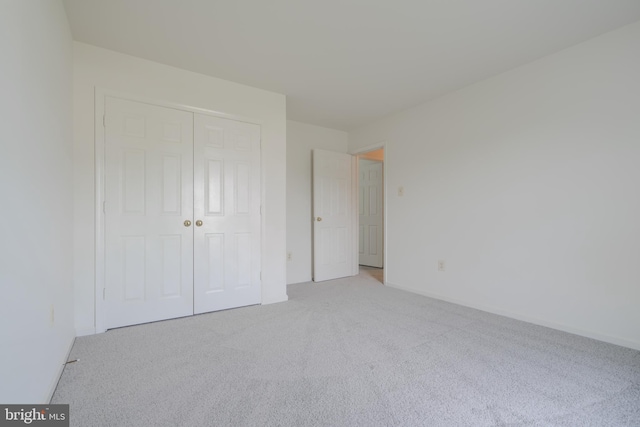 4001 Cedar Mills Rd, Randallstown, MD 21133 - unfurnished bedroom with carpet flooring, a closet, and baseboards