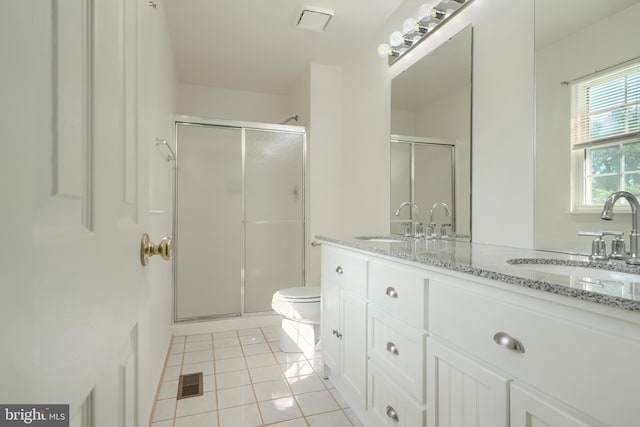 4001 Cedar Mills Rd, Randallstown, MD 21133 - full bathroom with double vanity, a stall shower, tile patterned floors, and toilet