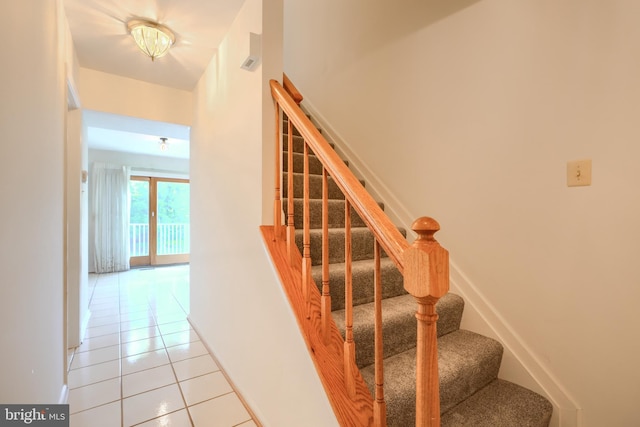4001 Cedar Mills Rd, Randallstown, MD 21133 - stairway featuring tile patterned flooring and baseboards
