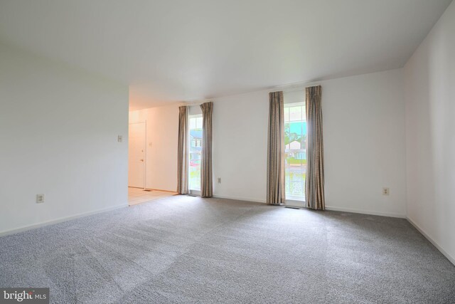 4001 Cedar Mills Rd, Randallstown, MD 21133 - empty room with light colored carpet and baseboards